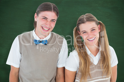Composite image of smiling geeky hipsters looking at camera