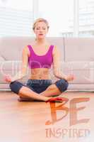 Composite image of fit blonde meditating in lotus pose