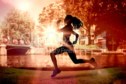 Composite image of full length of healthy woman jogging