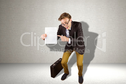 Composite image of young geeky businessman holding page