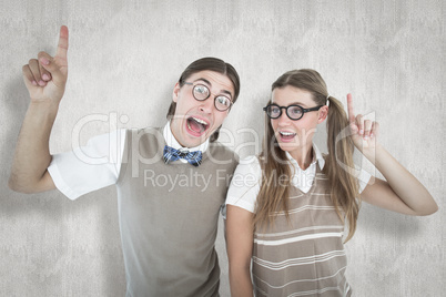 Composite image of geeky hipsters pointing