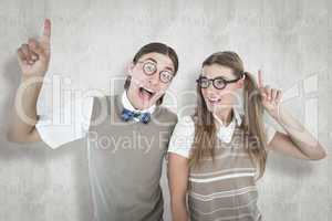 Composite image of geeky hipsters pointing