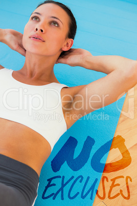 Composite image of determined young woman doing abdominal crunch