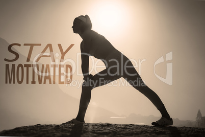 Composite image of sporty blonde stretching on the beach on a ro