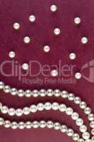 Silver and White pearls necklace on dark red