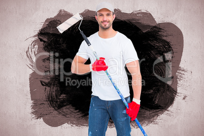 Composite image of handyman holding paint roller