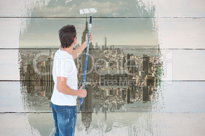 Composite image of man painting on white background