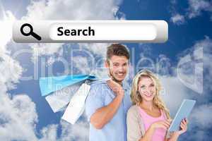 Composite image of attractive young couple holding shopping bags