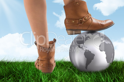 Composite image of cowboy boots dancing