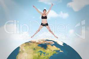 Composite image of full length of a sporty young woman jumping