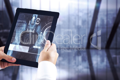 Composite image of man using tablet pc