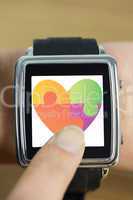 Composite image of businesswoman with smart watch on wrist