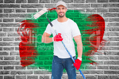 Composite image of handyman holding paint roller