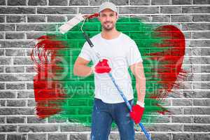 Composite image of handyman holding paint roller