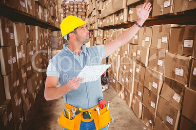 Composite image of male supervisor with hand raised holding clip