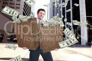 Composite image of businessman carrying bag of dollars