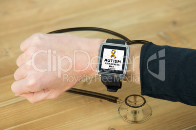 Composite image of businesswoman with smart watch on wrist