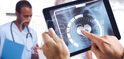 Composite image of man using tablet pc