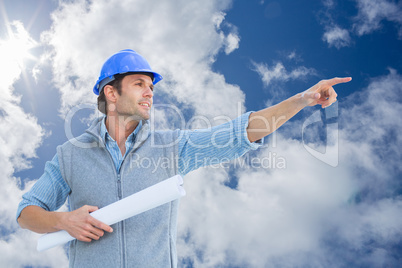 Composite image of architect pointing