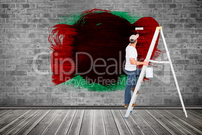 Composite image of handyman climbing ladder while using paint ro