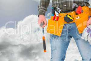 Composite image of manual worker holding gloves and hammer