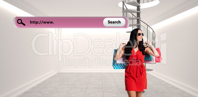 Composite image of woman standing with shopping bags