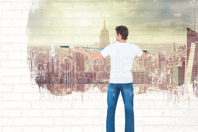 Composite image of man using paint roller on white background