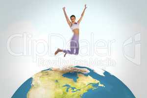 Composite image of sporty blonde jumping with arms out