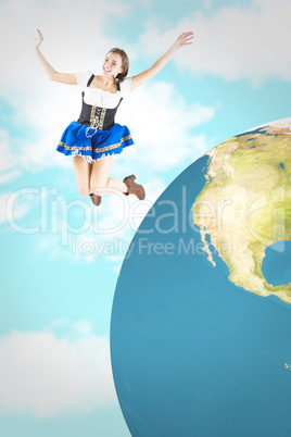 Composite image of pretty oktoberfest girl smiling and jumping