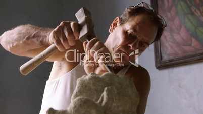 Sculptor in workshop, artist, art, craftsman, hispanic artisan, statue