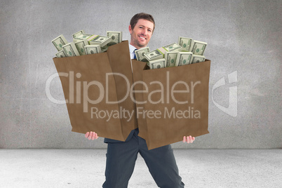 Composite image of businessman smiling with hands out