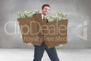 Composite image of businessman smiling with hands out