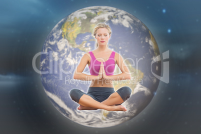 Composite image of calm blonde sitting in lotus pose with hands