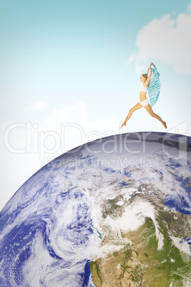 Composite image of gorgeous fit blonde leaping with scarf