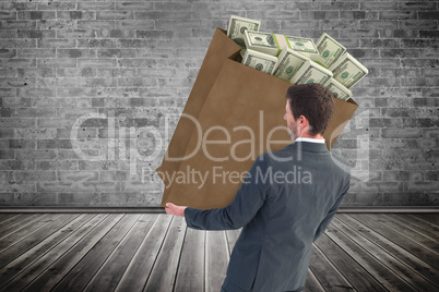Composite image of businessman smiling with hands out