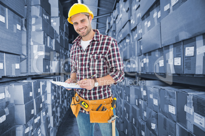 Composite image of confident male repairman writing on clipboard