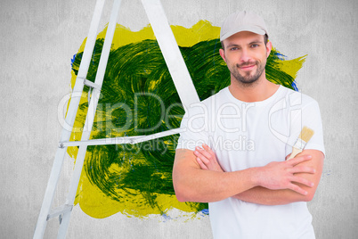 Composite image of handyman with paintbrush and ladder