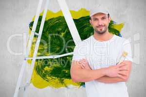 Composite image of handyman with paintbrush and ladder