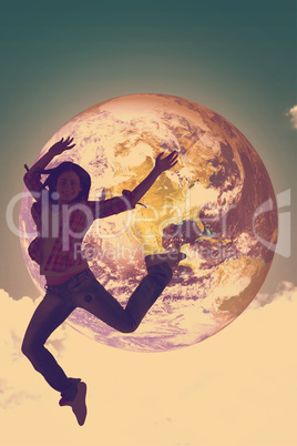 Composite image of casual brunette jumping and smiling