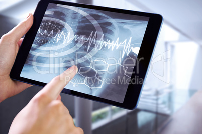 Composite image of man using tablet pc