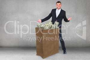 Composite image of businessman smiling with hands out