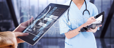 Composite image of man using tablet pc