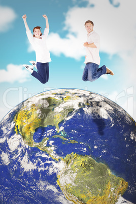 Composite image of couple jumping in the air