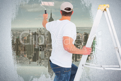 Composite image of handyman climbing ladder while using paint ro