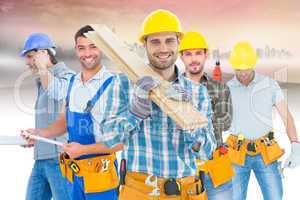 Composite image of construction worker carrying wooden planks