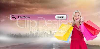 Composite image of stylish blonde in red dress holding shopping