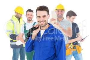 Composite image of smiling repairman holding cable