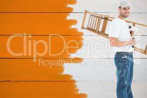 Composite image of man with paint roller and step ladder