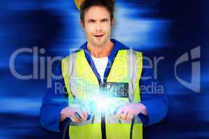 Composite image of electrician getting a shock while holding cab