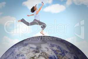 Composite image of happy classy businesswoman jumping while hold